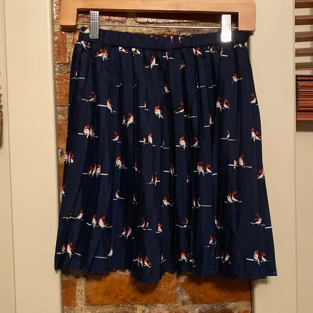 Pleated silk skirt with birds